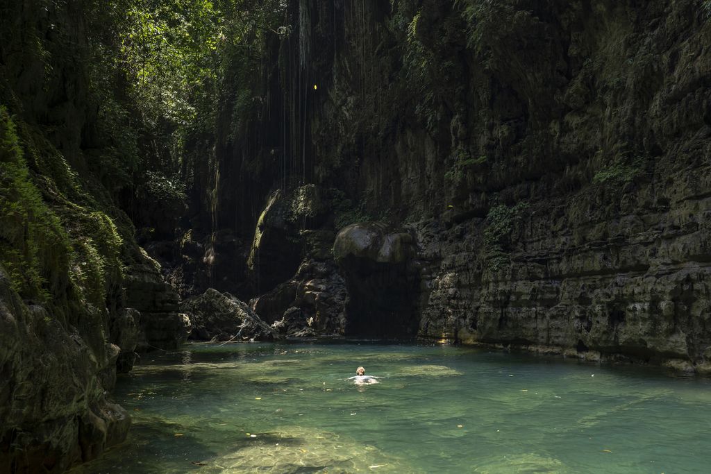 A Euopean woman swimming at the Green Canyon near Pangandaran on the 30th October 2019 in Java in Indonesia. (photo by Sam Mellish / In Pictures via Getty Images)