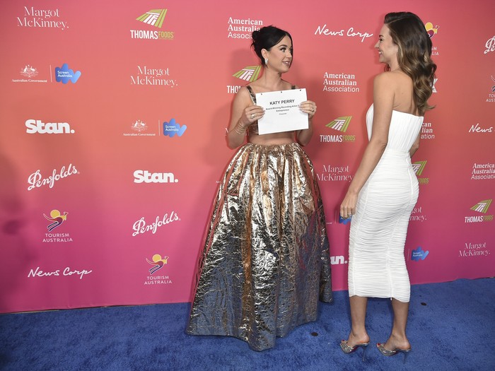Katy Perry, left, and Miranda Kerr arrive at the G'Day USA Arts Gala on Saturday, Jan. 28, 2023, at the Skirball Cultural Center in Los Angeles. (Photo by Richard Shotwell/Invision/AP)