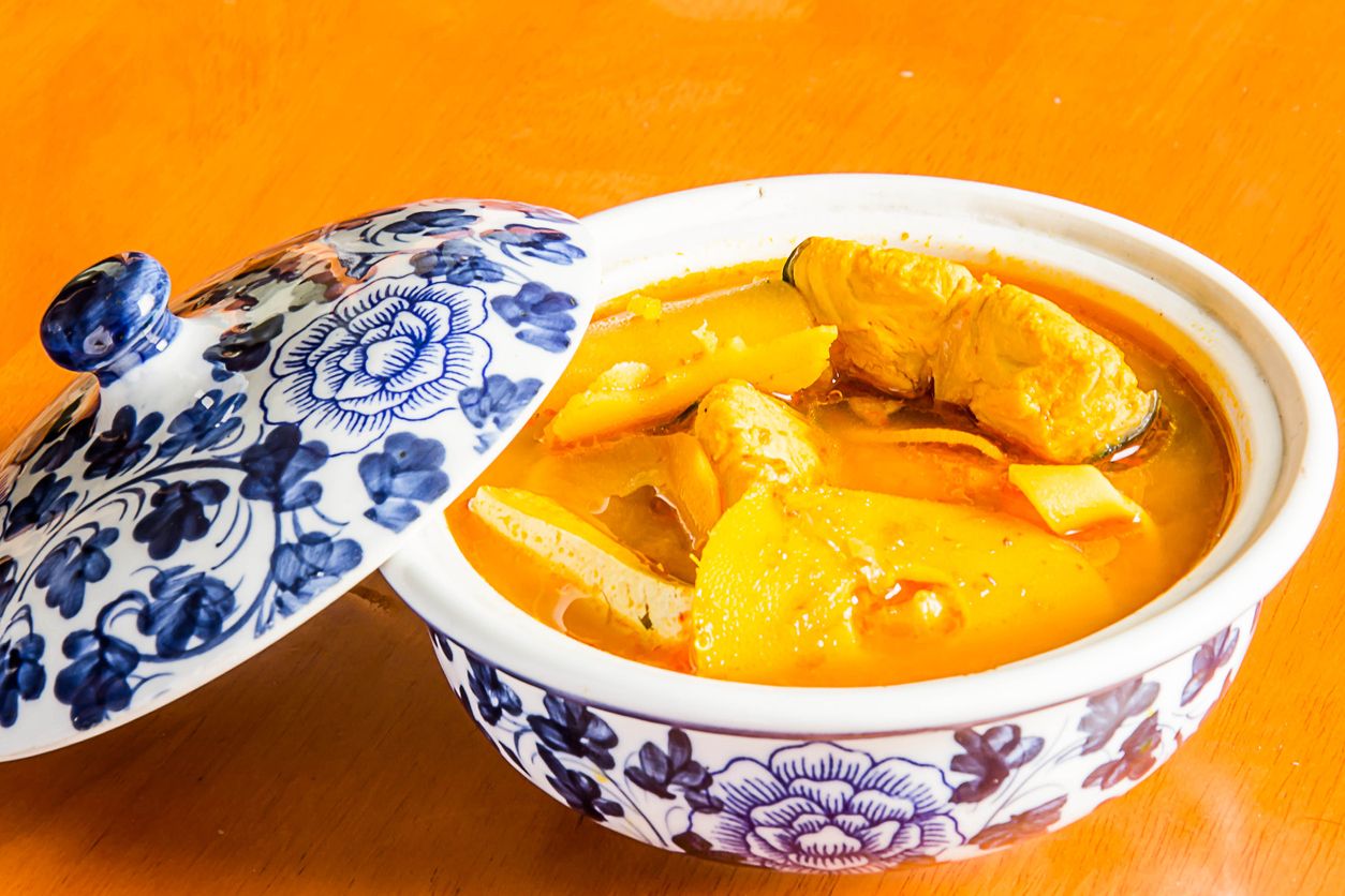 Southern Thai Spicy Sour Yellow Curry with Sea Bass and Coconut Shoots, Sour soup made of Tamarind Paste or Turmeric.