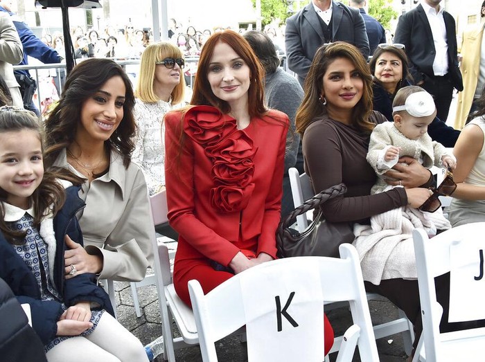 Sophie Turner, from left, Priyanka Chopra and her daughter Malti Marie Chopra Jonas attend a ceremony honoring The Jonas Brothers with a star on The Hollywood Walk of Fame on Monday, Jan. 30, 2023, in Los Angeles. (Photo by Jordan Strauss/Invision/AP)