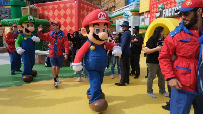 Guests ride Super Mario Kart during a preview of Super Nintendo World at Universal Studios in Los Angeles, California, on January 13, 2023. - Nintendo's first theme park outside of its native Japan will open in California next month, just weeks before Mario gets the big-screen treatment in a major new Hollywood film. 