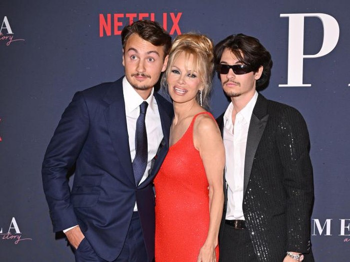 WEST HOLLYWOOD, CA - MARCH 20: Actress Pamela Anderson (C) and her sons Brandon Thomas Lee (R) and Dylan Jagger Lee attend the Daily Front Row 