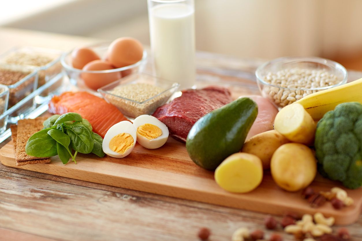 healthy eating and diet concept - natural rich in protein food on table
