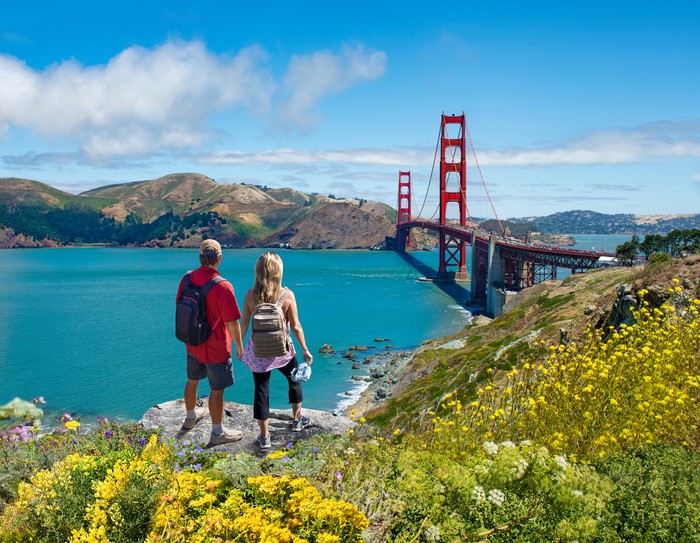Couple enjoying beautiful coastal scenery on summer vacation. People  on vacation  in San Francisco. Golden Gate Bridge, San Francisco Bay, San Francisco, California, USA.