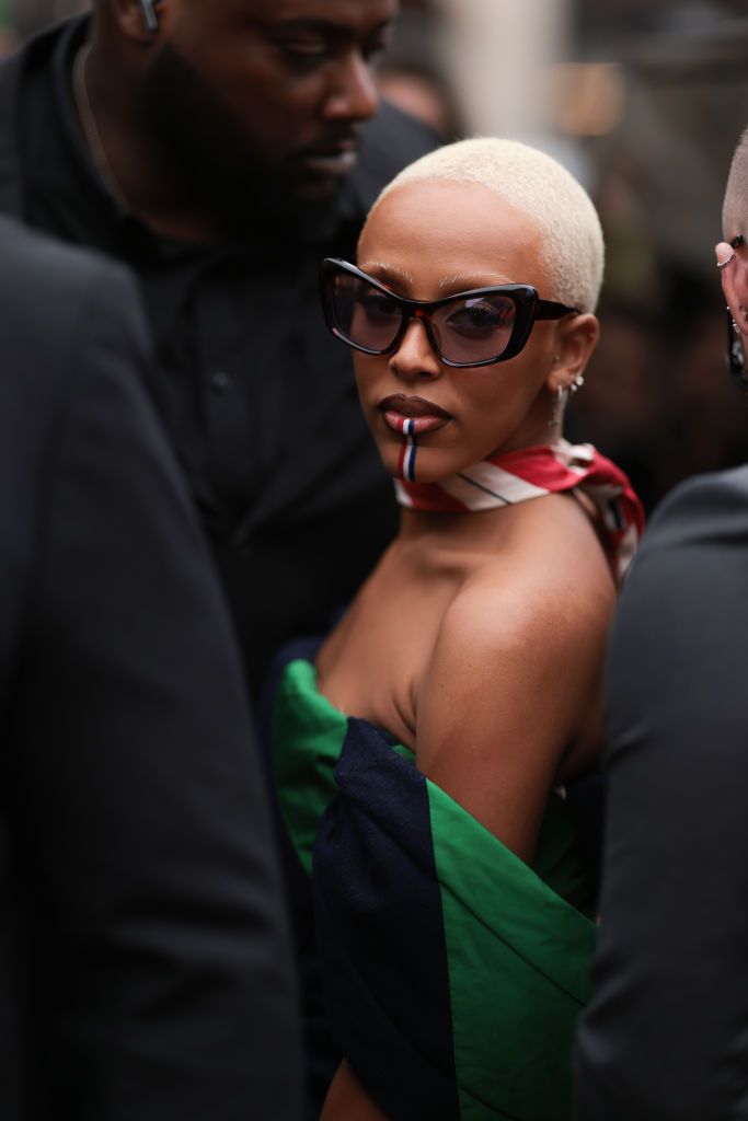 PARIS, FRANCE - OCTOBER 03: Doja Cat is seen wearing a green and blue patterned dress, outside Thom Browne during Paris Fashion Week on October 03, 2022 in Paris, France. (Photo by Jeremy Moeller/Getty Images)