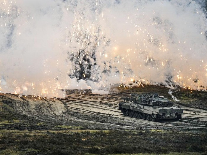 A Leopard 2 tank is seen in action during a visit of German Defense Minister Boris Pistorius at the Bundeswehr tank battalion 203 at the Field Marshal Rommel Barracks in Augustdorf, Germany, Wednesday, Feb. 1, 2023. After the governments decision to deliver fourteen Leopard 2 tanks to Ukraine, the capabilities of the Leopard 2A6 main battle tank are shown at a presentation in Augustdorf. (AP Photo/Martin Meissner)