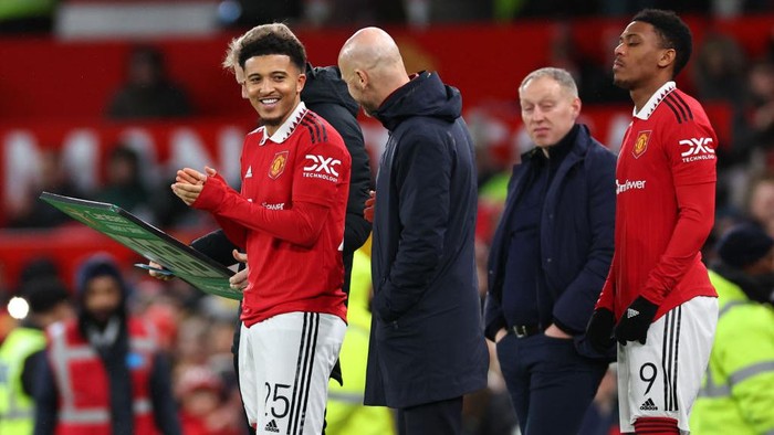 MANCHESTER, ENGLAND - FEBRUARY 01: Jadon Sancho of Manchester United and Erik Ten Hag the manager / head coach of Manchester United during the Carabao Cup Semi Final 2nd Leg match between Manchester United and Nottingham Forest at Old Trafford on February 1, 2023 in Manchester, England. (Photo by Robbie Jay Barratt - AMA/Getty Images)