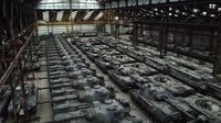 Puluhan tank Leopard 1 buatan Jerman dan kendaraan lapis baja lainnya terlihat di hanggar Tournais, Belgia, Selasa (31/1/2023).  