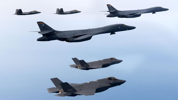 A handout photo dated February 1, 2023 shows South Korean and U.S. Air Forces conducting a combined air training with South Korean F-35A fighters, US B-1B strategic bombers, and F-22 and F-35B fighters participating in the skies over the West Sea, in South Korea. South Korean Defense Ministry/Handout via REUTERS