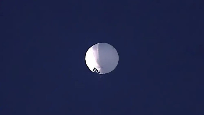ADDS PENTAGON RESPONSE THAT IT WOULD NOT CONFIRM - A high altitude balloon floats over Billings, Mont., on Wednesday, Feb. 1, 2023. The U.S. is tracking a suspected Chinese surveillance balloon that has been spotted over U.S. airspace for a couple days, but the Pentagon decided not to shoot it down due to risks of harm for people on the ground, officials said Thursday, Feb. 2, 2023. The Pentagon would not confirm that the balloon in the photo was the surveillance balloon. (Larry Mayer/The Billings Gazette via AP)