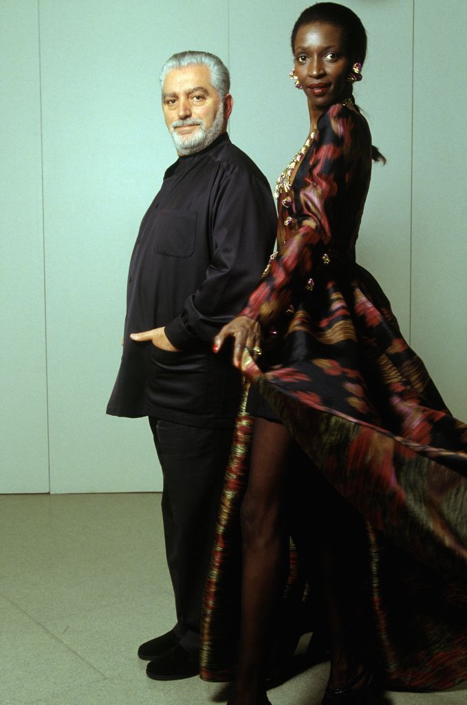 PARIS, FRANCE - NOVEMBER 11: Fashion Designer Paco Rabanne And Top Model Esther Kamatari, Paris, November 14, 1994. (Photo by Alexis DUCLOS/Gamma-Rapho via Getty Images)