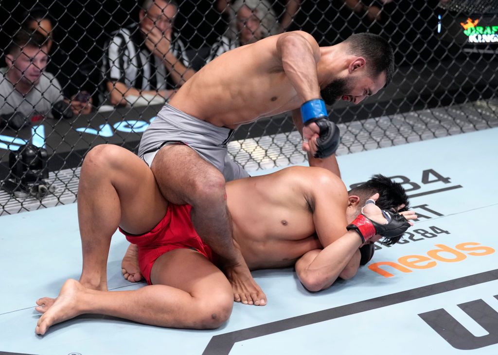 LAS VEGAS, NEVADA - FEBRUARY 04: (L-R) Anshul Jubli of India punches Jeka Saragih of Indonesia in a lightweight fight during the UFC Fight Night event at UFC APEX on February 04, 2023 in Las Vegas, Nevada. (Photo by Jeff Bottari/Zuffa LLC via Getty Images)