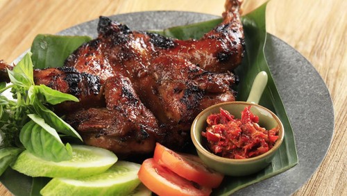 Bakakak Hayam or Ayam Bekakak or Grilled Whole Chicken Seasoning with Soy Sauce. Dish from West Java and Jakarta, Indonesia. Close Up