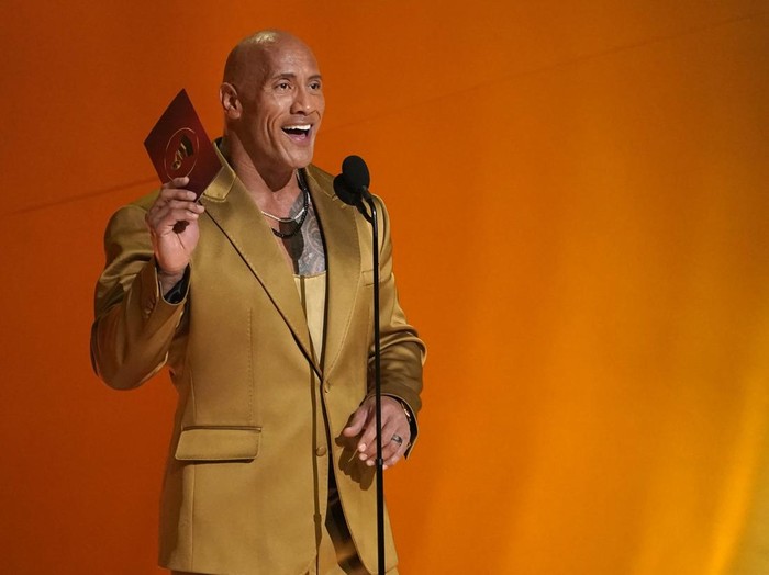 Dwayne Johnson presents the award for best pop solo performance at the 65th annual Grammy Awards on Sunday, Feb. 5, 2023, in Los Angeles. (AP Photo/Chris Pizzello)