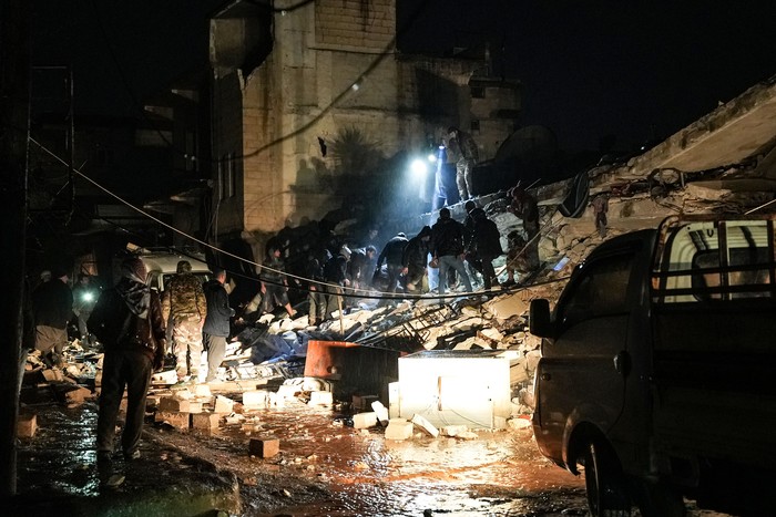 Civilians and fighters sift through the rubble of a collapsed building looking for victims and survivors following an earthquake in the town of Jandaris, in the countryside of Syrias northwestern city of Afrin in the rebel-held part of Aleppo province, early on February 6, 2023. - At least 42 have been reportedly killed in north Syria after a 7.8-magnitude earthquake that originated in Turkey and was felt across neighbouring countries. (Photo by Rami al SAYED / AFP) (Photo by RAMI AL SAYED/AFP via Getty Images)