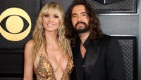 Hadir bersama sang suami, Tom Kaulitz, Heidi terlihat seksi menawan dengan dress berbelahan rendah. REUTERS/DAVID SWANSON