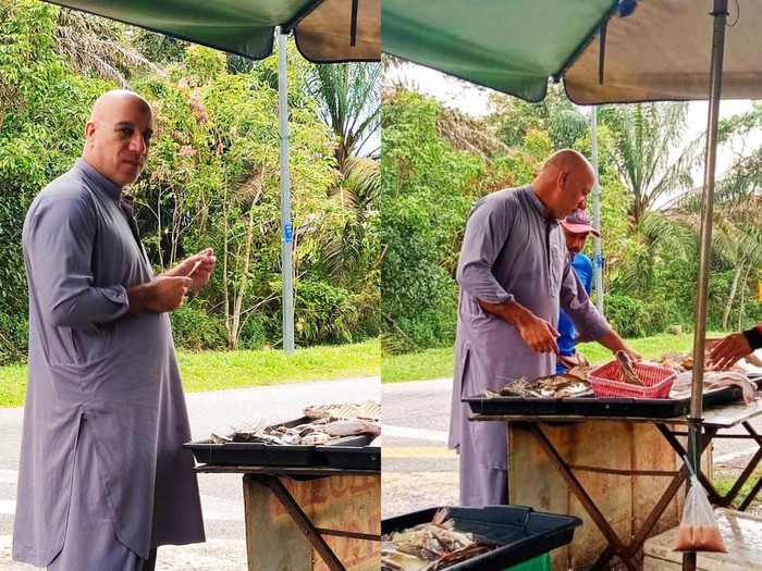 Viral Tukang Ikan Bakar ‘Kembaran’ Vin Diesel Lagi Jualan