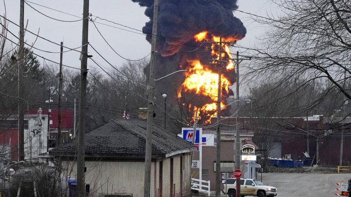 A black plume rises over East Palestine, Ohio, as a result of a controlled detonation of a portion of the derailed Norfolk and Southern trains Monday, Feb. 6, 2023. (AP Photo/Gene J. Puskar)