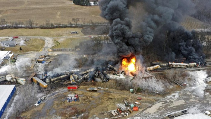 A black plume rises over East Palestine, Ohio, as a result of a controlled detonation of a portion of the derailed Norfolk and Southern trains Monday, Feb. 6, 2023. (AP Photo/Gene J. Puskar)