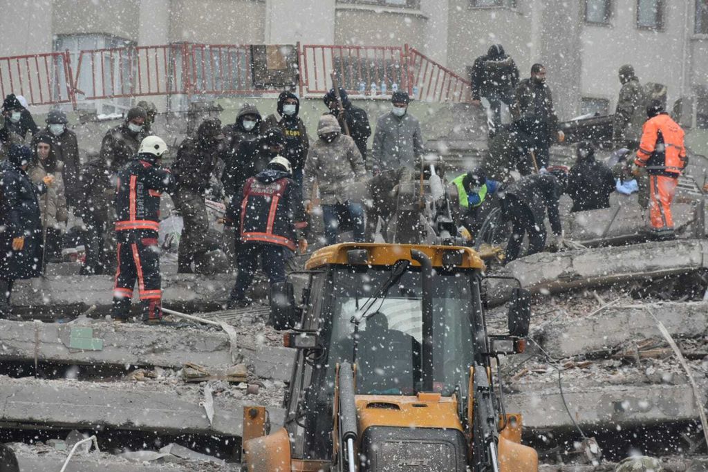 MALATYA, TURKIYE - FEBRUARY 6: A person is rescued from the wreckage of a building during search and rescue efforts after a 7.4 magnitude earthquake hit southern provinces of Turkiye, in Malatya, Turkiye on February 6, 2023. The 7.4 magnitude earthquake jolted Turkiye's southern province of Kahramanmaras early Monday, according to Turkiye's Disaster and Emergency Management Authority (AFAD). It was followed by a magnitude 6.4 quake that struck southeastern Gaziantep province. A third earthquake with a 6.5 magnitude also hit Gaziantep. Earthquakes had affected several provinces including, Osmaniye, Malatya, Adiyaman, Adana, Diyarbakir, Kilis and Sanliurfa. (Photo by Orhan Yoldas/Anadolu Agency via Getty Images)