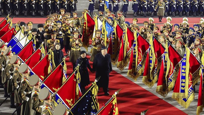 In this photo provided by the North Korean government, North Korean leader Kim Jong Un, center left, with his daughter attends a military parade to mark the 75th founding anniversary of the Korean People’s Army on Kim Il Sung Square in Pyongyang, North Korea Wednesday, Feb. 8, 2023. Independent journalists were not given access to cover the event depicted in this image distributed by the North Korean government. The content of this image is as provided and cannot be independently verified. Korean language watermark on image as provided by source reads: 