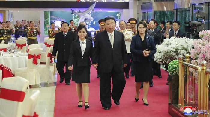 In this photo provided by the North Korean government, North Korean leader Kim Jong Un, center left, with his daughter attends a military parade to mark the 75th founding anniversary of the Korean People’s Army on Kim Il Sung Square in Pyongyang, North Korea Wednesday, Feb. 8, 2023. Independent journalists were not given access to cover the event depicted in this image distributed by the North Korean government. The content of this image is as provided and cannot be independently verified. Korean language watermark on image as provided by source reads: 