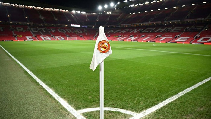 A Manchester United flag is pictured on the corner of the pitch prior to the start of the English Premier League football match between Manchester United and Leeds United at Old Trafford in Manchester, north west England, on February  8, 2023. - RESTRICTED TO EDITORIAL USE. No use with unauthorized audio, video, data, fixture lists, club/league logos or live services. Online in-match use limited to 120 images. An additional 40 images may be used in extra time. No video emulation. Social media in-match use limited to 120 images. An additional 40 images may be used in extra time. No use in betting publications, games or single club/league/player publications. (Photo by Oli SCARFF / AFP) / RESTRICTED TO EDITORIAL USE. No use with unauthorized audio, video, data, fixture lists, club/league logos or live services. Online in-match use limited to 120 images. An additional 40 images may be used in extra time. No video emulation. Social media in-match use limited to 120 images. An additional 40 images may be used in extra time. No use in betting publications, games or single club/league/player publications. / RESTRICTED TO EDITORIAL USE. No use with unauthorized audio, video, data, fixture lists, club/league logos or live services. Online in-match use limited to 120 images. An additional 40 images may be used in extra time. No video emulation. Social media in-match use limited to 120 images. An additional 40 images may be used in extra time. No use in betting publications, games or single club/league/player publications. (Photo by OLI SCARFF/AFP via Getty Images)
