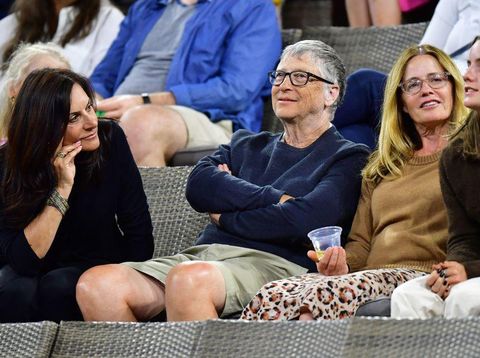 US businessman Bill Gates (2nd L) attends the tennis match between Paula Badosa of Spain and Maria Sakkari of Greece during their WTA semifinal match at the Indian Wells tennis tournament on March 18, 2022 in Indian Wells, California. (Photo by Frederic J. BROWN / AFP) (Photo by FREDERIC J. BROWN/AFP via Getty Images)