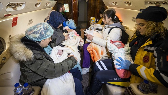 KAHRAMANMARAS, TURKIYE - FEBRUARY 08: Babies rescued from the rubble of collapsed buildings in Kahramanmaras are being transferred to Ankara by Turkish Presidential Plane after 7.7 and 7.6 magnitude earthquakes hit Turkiyes multiple provinces on February 8, 2023. 16 babies, left unaccompanied due to earthquake transferred to Ankara for care. Early Monday morning, a strong 7.7 earthquake, centered in the Pazarcik district, jolted Kahramanmaras and strongly shook several provinces, including Gaziantep, Kahramanmaras, Diyarbakir, Adana, Adiyaman, Malatya, Osmaniye, Hatay, and Kilis. Later, at 13.24 p.m. (1024GMT), a 7.6 magnitude quake centered in Kahramanmaras Elbistan district struck the region. Turkiye declared 7 days of national mourning after deadly earthquakes in southern provinces. (Photo by Mehmet Ali Ozcan/Anadolu Agency via Getty Images)