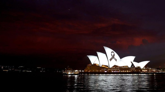 SYDNEY, AUSTRALIA - FEBRUARY 09: A black ribbon, symbolising remembrance and mourning, is seen projected on the Sydney Opera House sails on February 09, 2023 in Sydney, Australia. The projections on the iconic Sydney landmark are to show solidarity with Turkey and Syria following deadly earthquakes on Monday. (Photo by Mark Metcalfe/Getty Images)