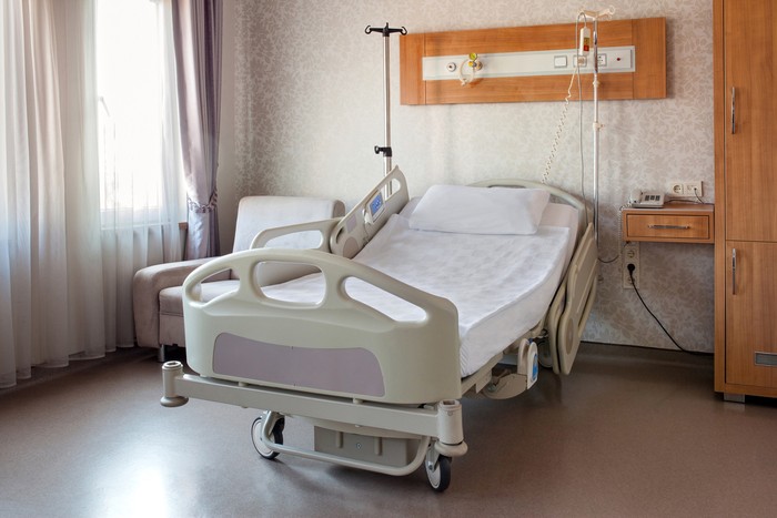 Empty bed on hospital ward
