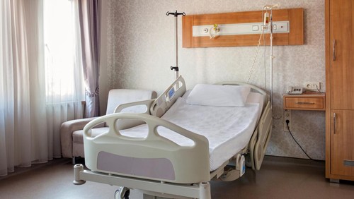 Empty bed on hospital ward