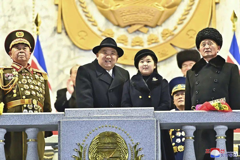 In this photo provided by the North Korean government, North Korean leader Kim Jong Un, center left, with his daughter attends a military parade to mark the 75th founding anniversary of the Korean People's Army on Kim Il Sung Square in Pyongyang, North Korea Wednesday, Feb. 8, 2023. Independent journalists were not given access to cover the event depicted in this image distributed by the North Korean government. The content of this image is as provided and cannot be independently verified. Korean language watermark on image as provided by source reads: 