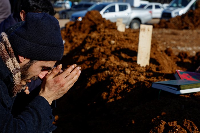 People bury victims of the deadly earthquake, in a cemetery in Kahramanmaras, Turkey February 9, 2023. REUTERS/Suhaib Salem