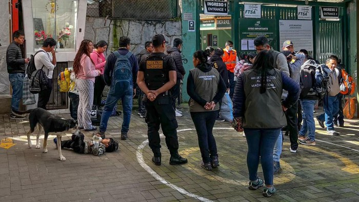 People gather outside the train station of the town of Machu Picchu, Peru to leave after the arrival of the first train following the service from Ollantaytambo renewal on February 8, 2023. - The train service to Machu Picchu in Peru was partially reactivated this Wednesday to transport local residents, after the suspension of almost three weeks due to blockades of the railways due to the anti-government protests that have shaken the Andean country. (Photo by Carolina Paucar / AFP) (Photo by CAROLINA PAUCAR/AFP via Getty Images)