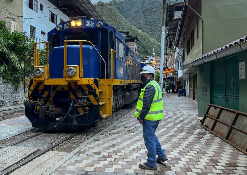 People gather outside the train station of the town of Machu Picchu, Peru to leave after the arrival of the first train following the service from Ollantaytambo renewal on February 8, 2023. - The train service to Machu Picchu in Peru was partially reactivated this Wednesday to transport local residents, after the suspension of almost three weeks due to blockades of the railways due to the anti-government protests that have shaken the Andean country. (Photo by Carolina Paucar / AFP) (Photo by CAROLINA PAUCAR/AFP via Getty Images)