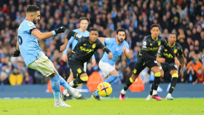 MANCHESTER, ENGLAND - FEBRUARY 12: Riyad Mahrez of Manchester City scores their sides third goal from the penalty spot during the Premier League match between Manchester City and Aston Villa at Etihad Stadium on February 12, 2023 in Manchester, England. (Photo by Matt McNulty - Manchester City/Manchester City FC via Getty Images)