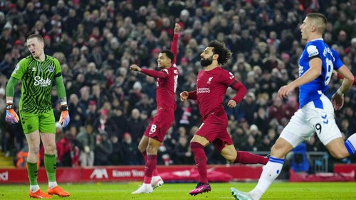 Liverpools Mohamed Salah, centre, celebrates after scoring his sides opening goal during the English Premier League soccer match between Liverpool and Everton at the Anfield stadium in Liverpool, England, Monday, Feb. 13, 2023. (AP Photo/Jon Super)