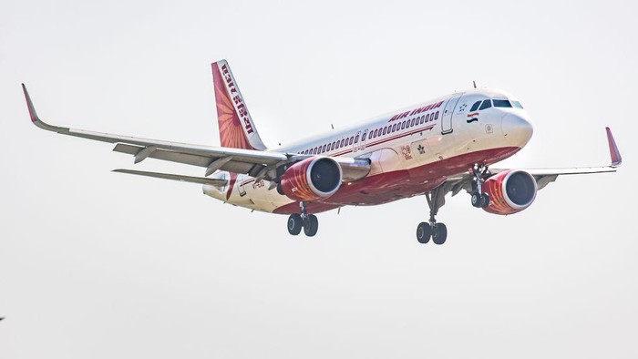 Air India Airbus A320 aircraft as seen flying over the mountains of Kathmandu valley and landing in Tribhuvan International Airport KTM. The arriving Airbus A320-200 passenger plane of the Indian carrier has the registration VT-EXD and is powered by 2x CFMI jet engines. AirIndia is the flag carrier of India, with headquarters in New Delhi, the airline is member of Star Alliance aviation group. Kathmandu, Nepal on April 2022 (Photo by Nicolas Economou/NurPhoto via Getty Images)