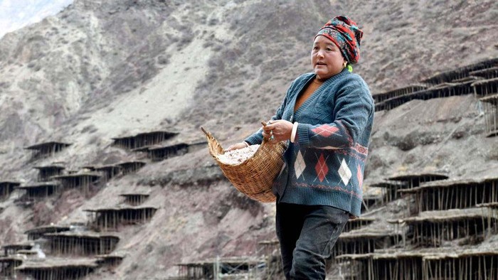 CHANGDU, CHINA - FEBRUARY 13: A villager watches salt pans along the Lancang River on February 13, 2023 in Markam County, Changdu City, Tibet Autonomous Region of China. Villagers in Markam County make salt by evaporating brine in the sun, which has a history of more than 1000 years. (Photo by Li Lin/China News Service/VCG via Getty Images)