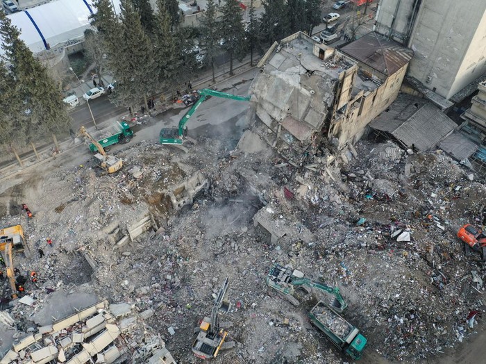 Rescuers work on the rubble of a collapsed building in the aftermath of a deadly earthquake in Kahramanmaras, Turkey February 14, 2023. REUTERS/Alexandros Avramidis