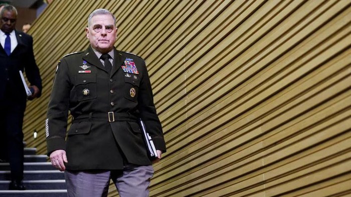 U.S. Chairman of the Joint Chiefs of Staff General Mark A. Milley and U.S. Secretary of Defense Lloyd Austin climb down a staircase ahead of a news conference on the day of the NATO defence ministers meeting at the Alliances headquarters in Brussels, Belgium, February 14, 2023. REUTERS/Johanna Geron