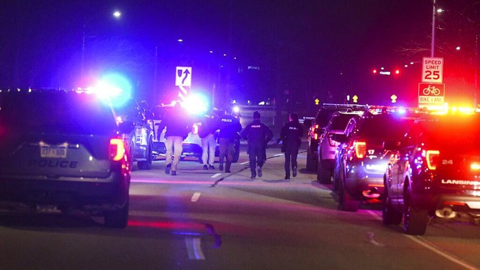 First responders run up Shaw Lane on the campus of Michigan State University, in East Lansing, Mich., Monday, Feb. 13, 2023, searching for a gunman after shots were fired on campus. (Matthew Dae Smith/Lansing State Journal via AP)