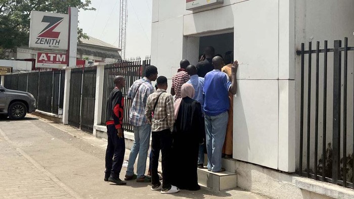 ABUJA, NIGERIA - FEBRUARY 14: Long queues are seen at the banks due to the cash shortage, in Abuja, Nigeria on February 14, 2023. In the country, the cash shortage that started due to the fact that there is not enough in the market to replace the old banknotes that will go out of circulation for security reasons continues. Days before the presidential election to be held on February 25 in the country, there are long queues at the banks. (Photo by Adam Abu-bashal/Anadolu Agency via Getty Images)
