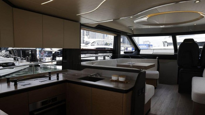 The kitchen and living room area of Absolute Yachts' 52 Fly flybridge cruiser during the Discover Boating Miami International Boat Show in Miami, Florida, On Wednesday, Feb. 15, 2023. Historically, the Miami International Boat Show and Miami Yacht Show have attracted hundreds of thousands of attendees to South Florida and generated an estimated combined annual economic impact of $1.34 billion. Photographer: Eva Marie Uzcategui/Bloomberg via Getty Images
