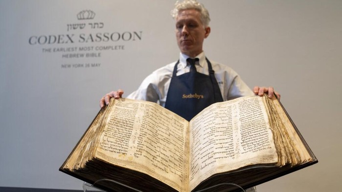 Sothebys unveils the Codex Sassoon for auction, Wednesday, Feb. 15, 2023, in the Manhattan borough of New York. The auction house is billing the lot as the earliest, most complete Hebrew Bible ever discovered. (AP Photo/John Minchillo)
