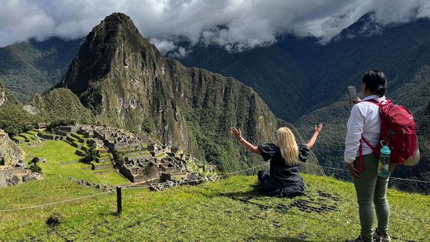 Tourists visit the ancient Inca ruins of Machu Picchu in the Urubamba valley, seventy-two kilometres from the Andes city of Cusco, on February 15, 2023, for the first time after they were closed to the public for security reasons on January 21, after protesters blocked the railways during protests against the government of President Dina Boluarte that have shaken the Andean country since December 7, 2022. (Photo by Carolina Paucar / AFP) (Photo by CAROLINA PAUCAR/AFP via Getty Images)