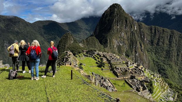 Tourists visit the ancient Inca ruins of Machu Picchu in the Urubamba valley, seventy-two kilometres from the Andes city of Cusco, on February 15, 2023, for the first time after they were closed to the public for security reasons on January 21, after protesters blocked the railways during protests against the government of President Dina Boluarte that have shaken the Andean country since December 7, 2022. (Photo by Carolina Paucar / AFP) (Photo by CAROLINA PAUCAR/AFP via Getty Images)