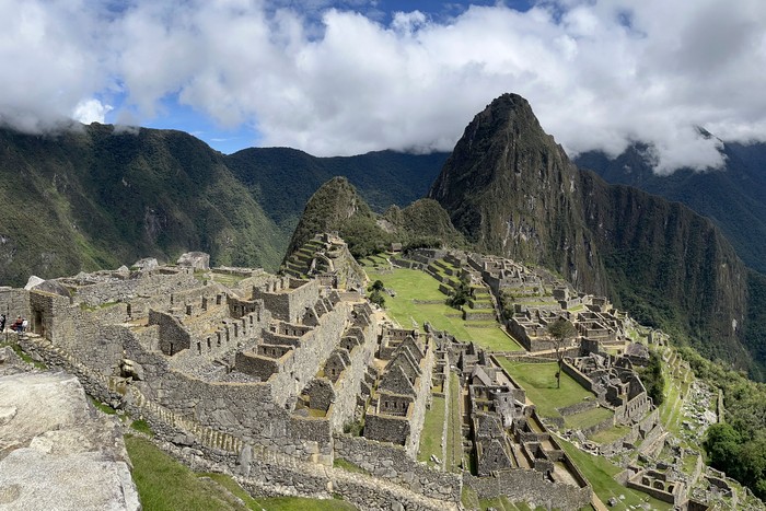 Tourists visit the ancient Inca ruins of Machu Picchu in the Urubamba valley, seventy-two kilometres from the Andes city of Cusco, on February 15, 2023, for the first time after they were closed to the public for security reasons on January 21, after protesters blocked the railways during protests against the government of President Dina Boluarte that have shaken the Andean country since December 7, 2022. (Photo by Carolina Paucar / AFP) (Photo by CAROLINA PAUCAR/AFP via Getty Images)