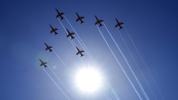 Indian Air Force's aerobatic team Suryakiran perform maneuvers on the first day of the Aero India 2023 at Yelahanka air base in Bengaluru, India, Monday, Feb. 13, 2023. Aero India is a biennial event with flying demonstrations by stunt teams and militaries and commercial pavilions where aviation companies display their products and technology. (AP Photo/Aijaz Rahi)